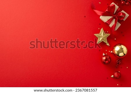 Toast to the New Year! Top-view perspective of elegant giftbox, festive ornaments, baubles, sparkling star, mistletoe, and confetti on a vibrant red surface, offering space for your holiday greetings
