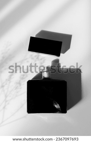Masculine perfume on white background. Minimalist composition. Royalty-Free Stock Photo #2367097693