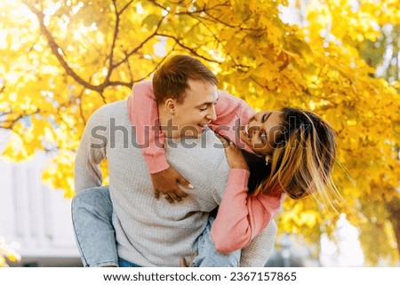 a European and an African-American girl in love are in bright emotions and tender feelings for each other Royalty-Free Stock Photo #2367157865