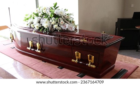 closeup shot of a funeral casket or coffin in a hearse or chapel or burial at cemetery
 Royalty-Free Stock Photo #2367164709