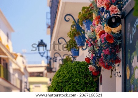 Colorful houses in the old town of Spain decorated with flowers