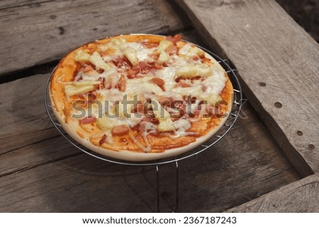 Ready-made pizza dough with homemade topping combinations such as hot dogs, ham, and cheese.