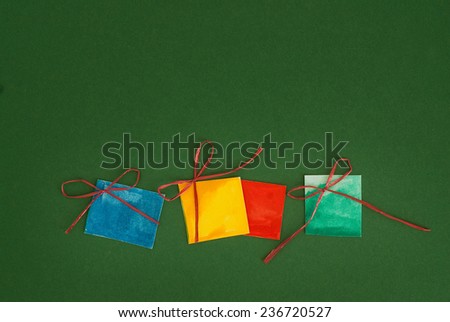 Paper gifts on green background