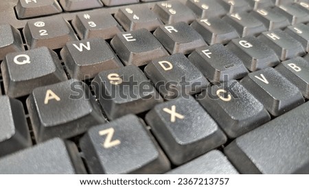Black keyboard with white alphabet lettering