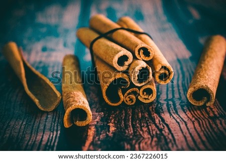 Cinnamon sticks on wooden background - vintage effect style pictures, shallow depth of field