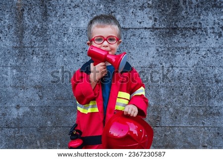 child dressed as a firefighter