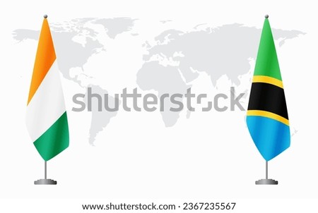 Ivory Coast and Tanzania flags for official meeting against background of world map. Royalty-Free Stock Photo #2367235567