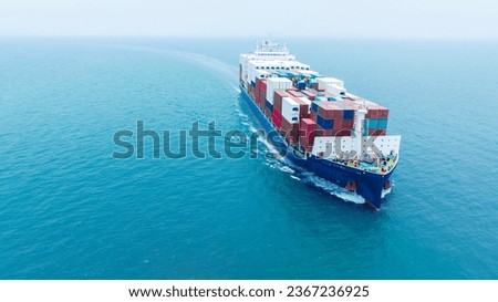 Aerial side view of smart cargo ship carrying container from custom container depot go to ocean concept freight shipping by ship service on blue sky .Freight Forwarding Service