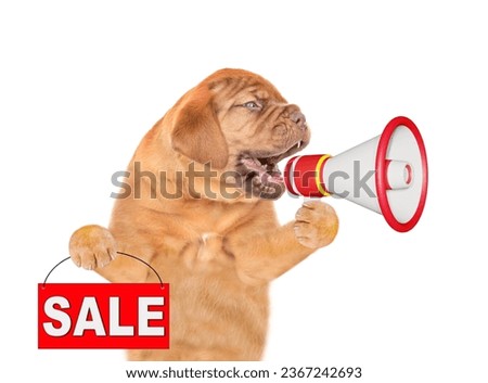 Mastiff puppy screaming into a megaphone and and shows signboard with labeled "sale". isolated on white background