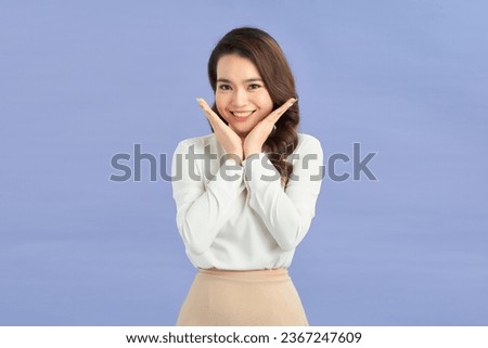 attractive asian girl with shy expreesion on color background Royalty-Free Stock Photo #2367247609