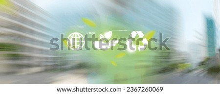 Reduce, reuse, recycle symbols. 3 recycle icons on motion blur of skyscrapers background.