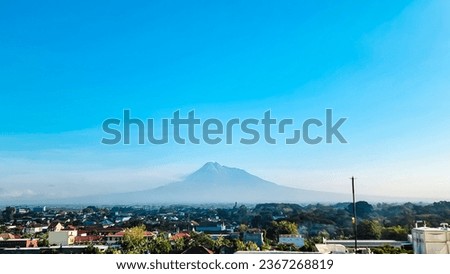 Beautiful landscape of the city of Yogyakarta with the backdrop of Mount Merapi and blue sky