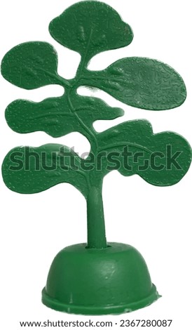 green tree plastic model toys, on isolated white background 