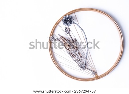Keys and pine tree pieces in a circle.