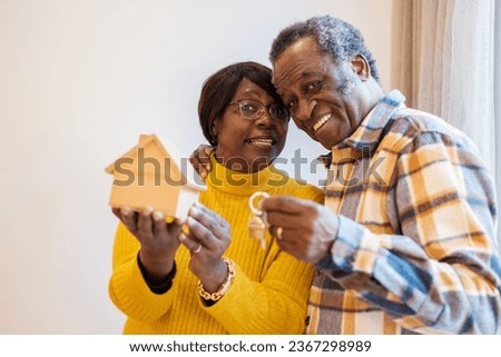Senior couple buying a new house to live in their retirement. Concept: lifestyle, new home, construction Royalty-Free Stock Photo #2367298989