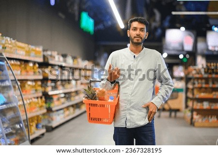 Man at grocery store products.