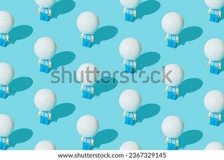 Plastic block toy with golf ball. Blue pastel background. Pattern.