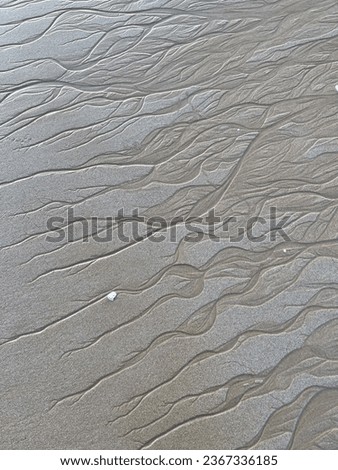 Watermarks on sand. Sandy background