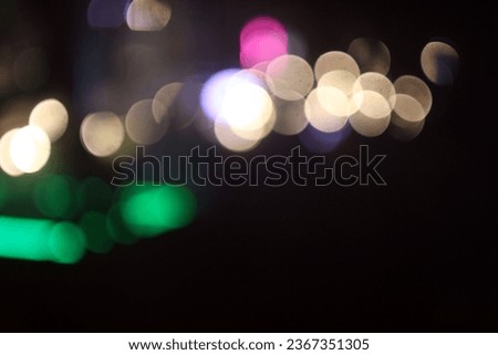 The colorful lights of motor vehicles blur and bokeh in the M Bloc area, CSW, South Jakarta, Indonesia, 22 August 2023 Royalty-Free Stock Photo #2367351305