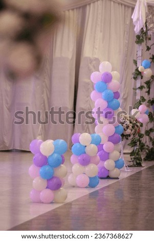 Party hall decorated with big balloons, Birthday Cake on a background balloons party decor, Birthday decorations, Baby's first year photoshoot.