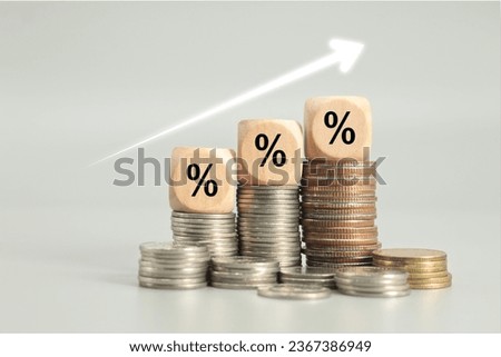 graph arrow and percent icon on wooden cube. inflation concept