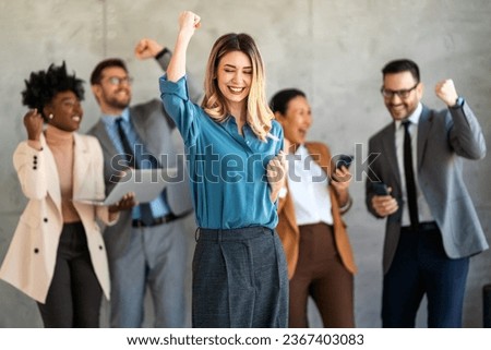 Excited overjoyed diverse business people, team celebrate corporate victory together in office Royalty-Free Stock Photo #2367403083