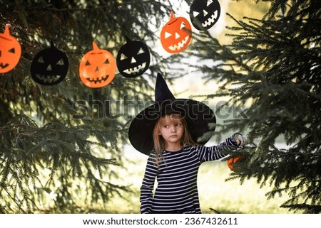 Smiling Halloween girl,Girl dressed as a witch, Halloween, pumpkin, jack o'Lantern