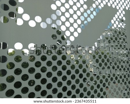 Jakarta's buildings and offices seen through glass holes