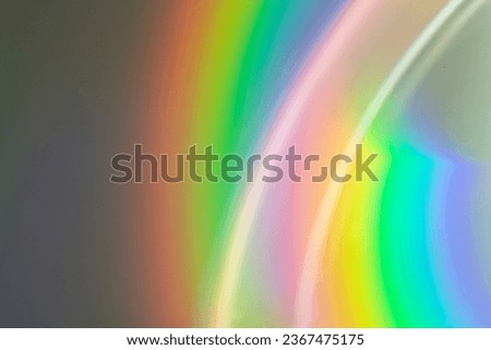 Blurred rainbow light refraction texture overlay effect for photos and mockups.