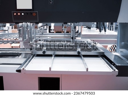 Packaging Stripping Blanking Machine. Die cutting machine. Royalty-Free Stock Photo #2367479503