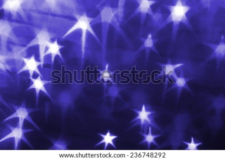 Holiday background with glowing stars