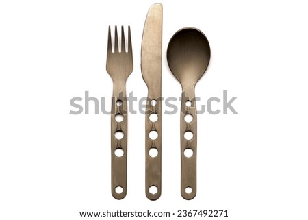 Titanium Camping Utensil Set of Knife, Fork, and Spoon on a white background