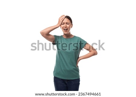 attractive young caucasian woman in a t-shirt is trying to remember a thought