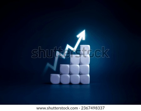 Rise up glowing arrow, volatility index chart on white blocks business chart steps on dark blue background. Business growth graph process, goal, success and economic improvement and analysis concepts. Royalty-Free Stock Photo #2367498337