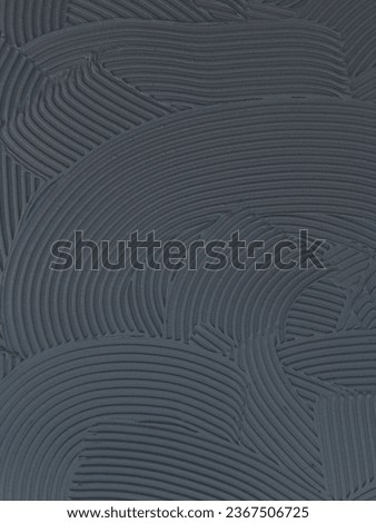 Cement wall cementitious adhesive applied to the floor.Modern gray background with curved lines
 Royalty-Free Stock Photo #2367506725