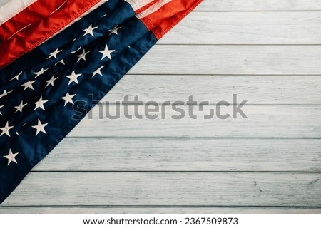 Celebrate Veterans Day with a patriotic concept, American flags on wooden background, symbolizing honor, pride, and democracy. November 11 is a day to honor our veterans.