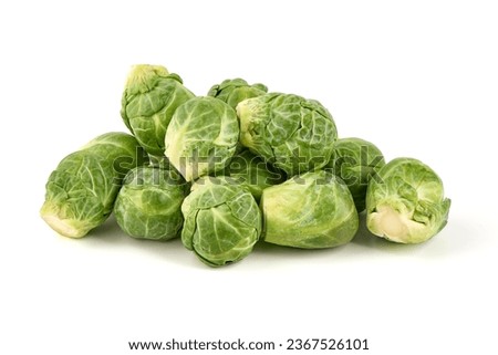 Fresh green Brussels sprouts, isolated on white background. High resolution image