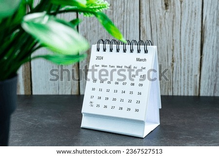 White March 2024 calendar on wooden desk. 2024 New Year Concept