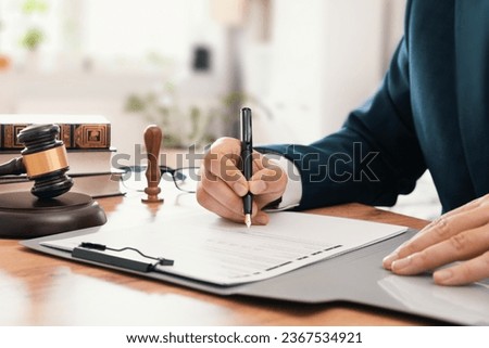 Notary public working in the office. Lawyer or attorney concept Royalty-Free Stock Photo #2367534921
