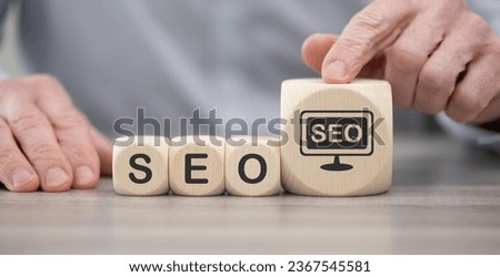 Wooden blocks with symbol of search engine optimization concept
