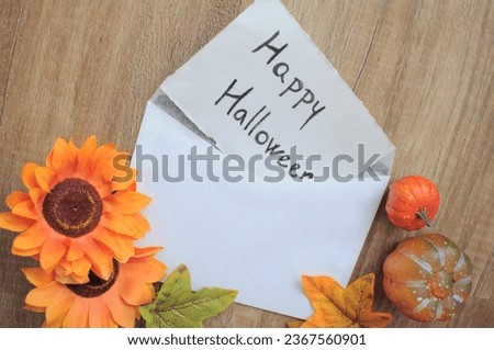 happy Halloween card in wooden background 
