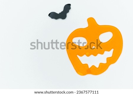 jelly pumpkin and bat on a white background

