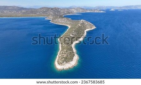 Aerial drone photo of Kinosoura long peninsula of land in paradise beach of Schoinias or Schinias, Marathon, Attica, Greece