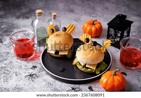Meat burger in the form of funny monster for Halloween holiday. toning