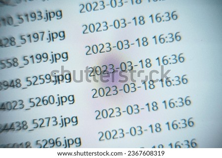 Macro photo of omage file listing on a computer screen.