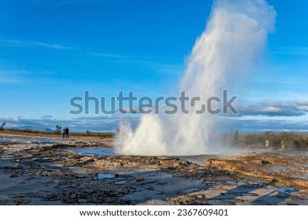 Strokkur, a fountain-type geyser located in a geothermal area beside the Hvítá River, southwestern Iceland, east of Reykjavík. It typically erupts every 6–10 minutes. Part of The Golden Circle Tour. Royalty-Free Stock Photo #2367609401
