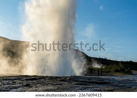 Strokkur, a fountain-type geyser located in a geothermal area beside the Hvítá River, southwestern Iceland, east of Reykjavík. It typically erupts every 6–10 minutes. Part of The Golden Circle Tour. Royalty-Free Stock Photo #2367609415