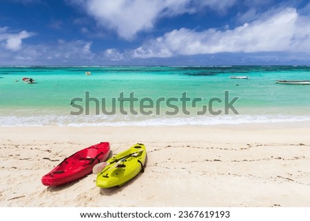 Seychelles beach landscape with colorful plastic kayaks on a sunny day Royalty-Free Stock Photo #2367619193