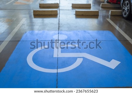Front view of parking for disabled people in a shopping center. accessible parking concept