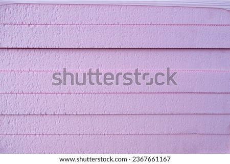 Pink Foam Board Product Extruded Polystyrene Insulation Foam XPS with drainage channels on the surface. Building material  waterproof and ground  thermal insulation coatings Royalty-Free Stock Photo #2367661167